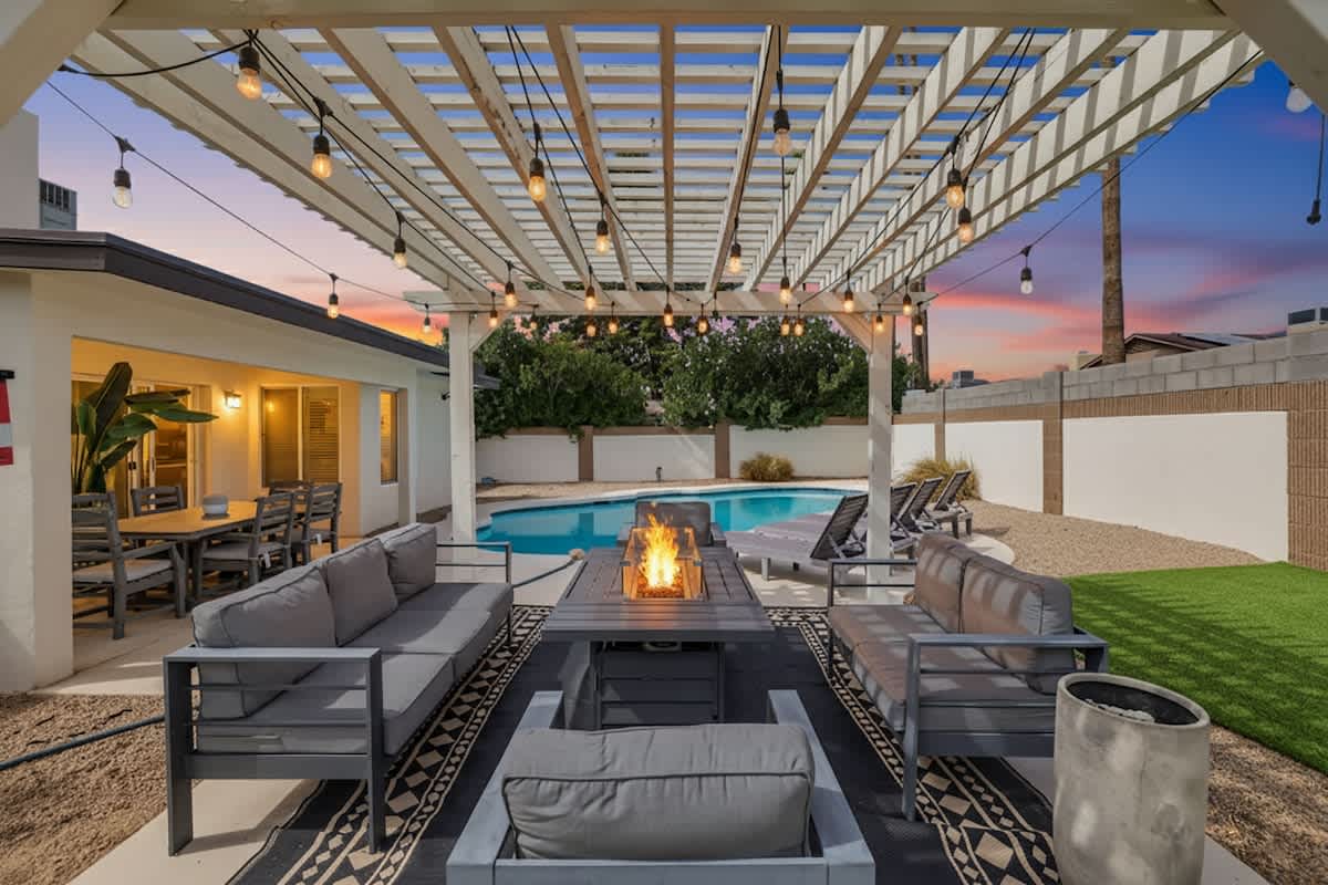 Firepit surrounded by chairs at dusk